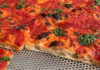 Pizza en wijn in Romeinse sfeer aan de Newtonstraat
